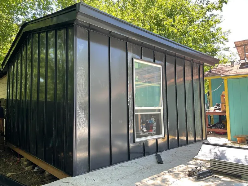 Black standing seam metal wall panels for Roof Inspection in Belle Plaine